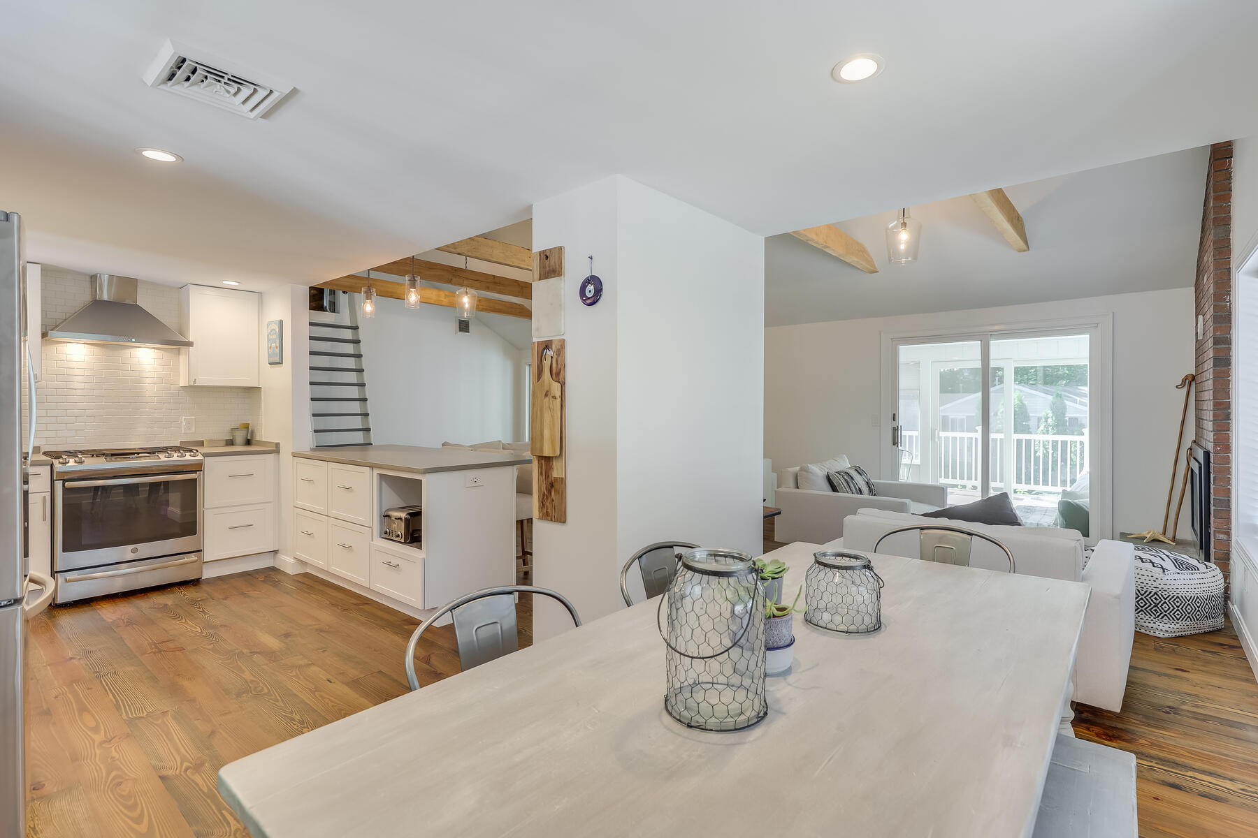 8 Cutlass Lane Mashpee, MA 02649 - Photo 3 of 30 a kitchen with a table and chairs