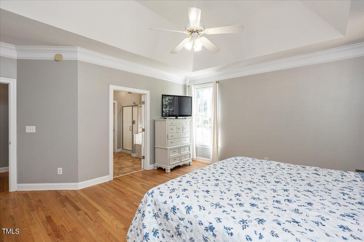 714 Continental Drive Durham, NC 27712 - Photo 20 of 34 a bedroom with a bed and a television