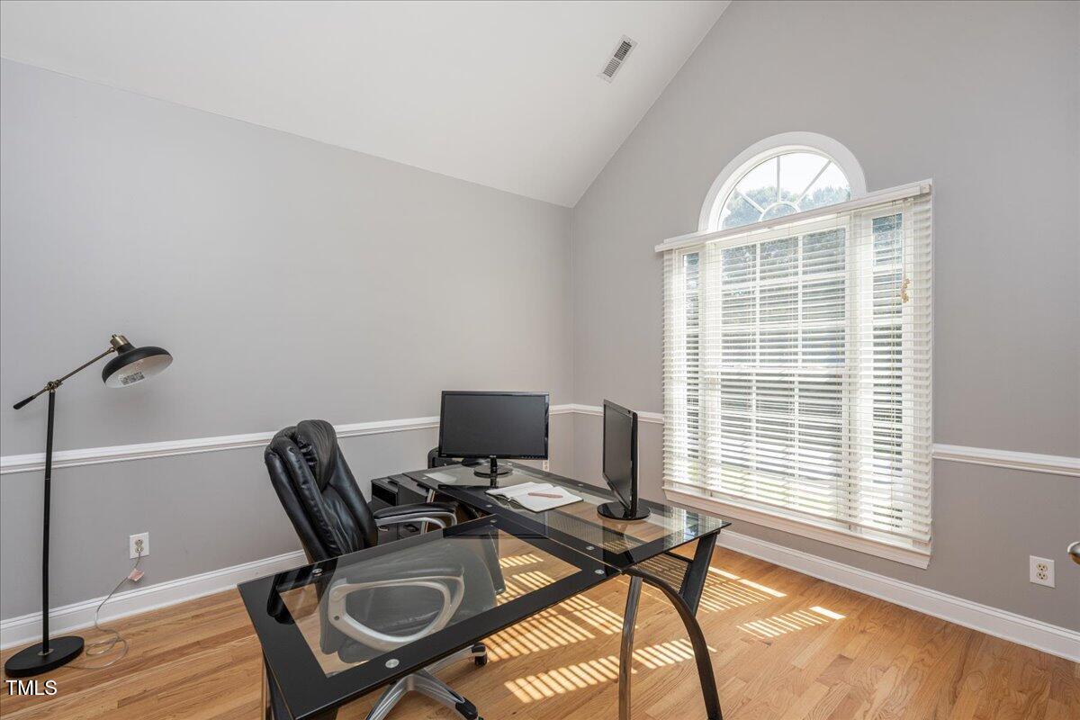 714 Continental Drive Durham, NC 27712 - Photo 7 of 34 a view of a workspace with furniture and a window
