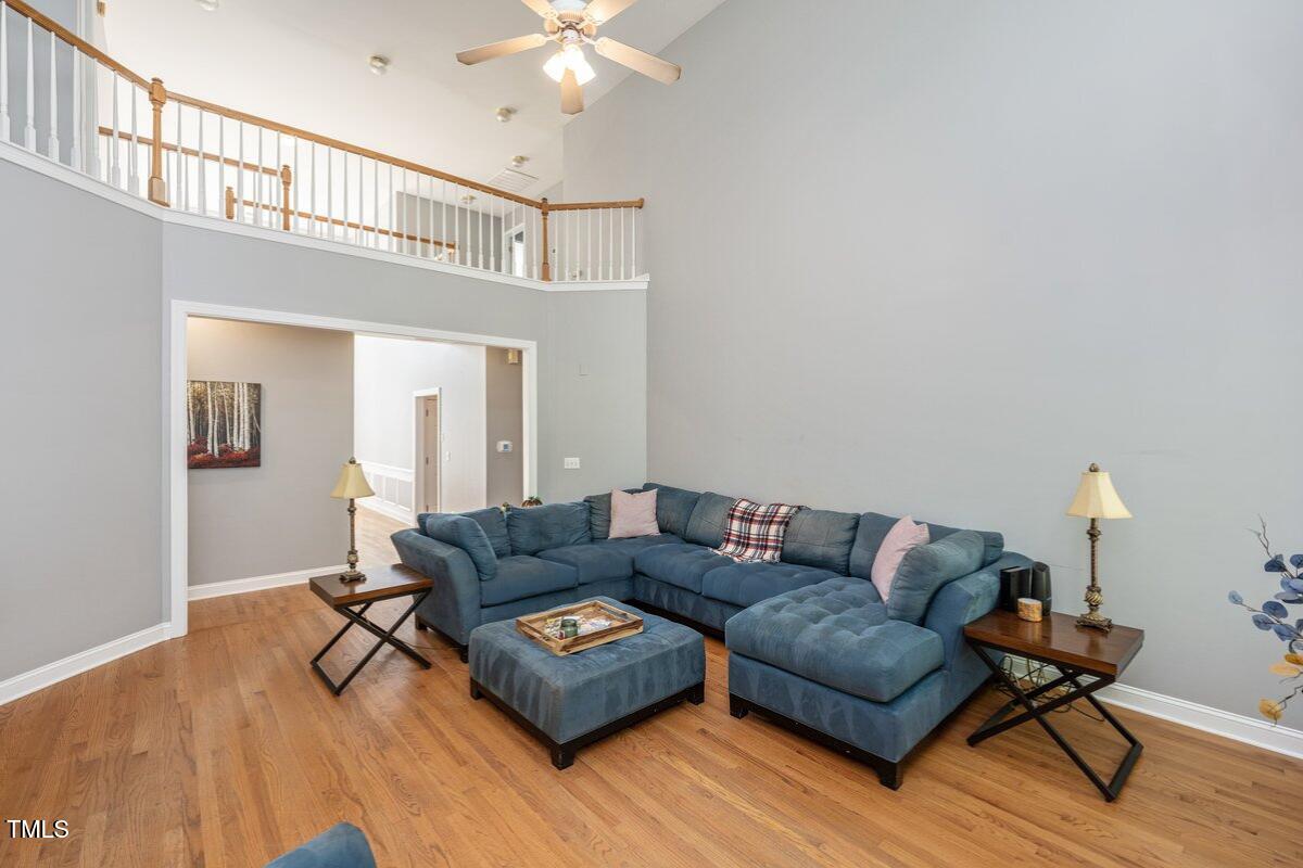 714 Continental Drive Durham, NC 27712 - Photo 9 of 34 a living room with furniture and a wooden floor