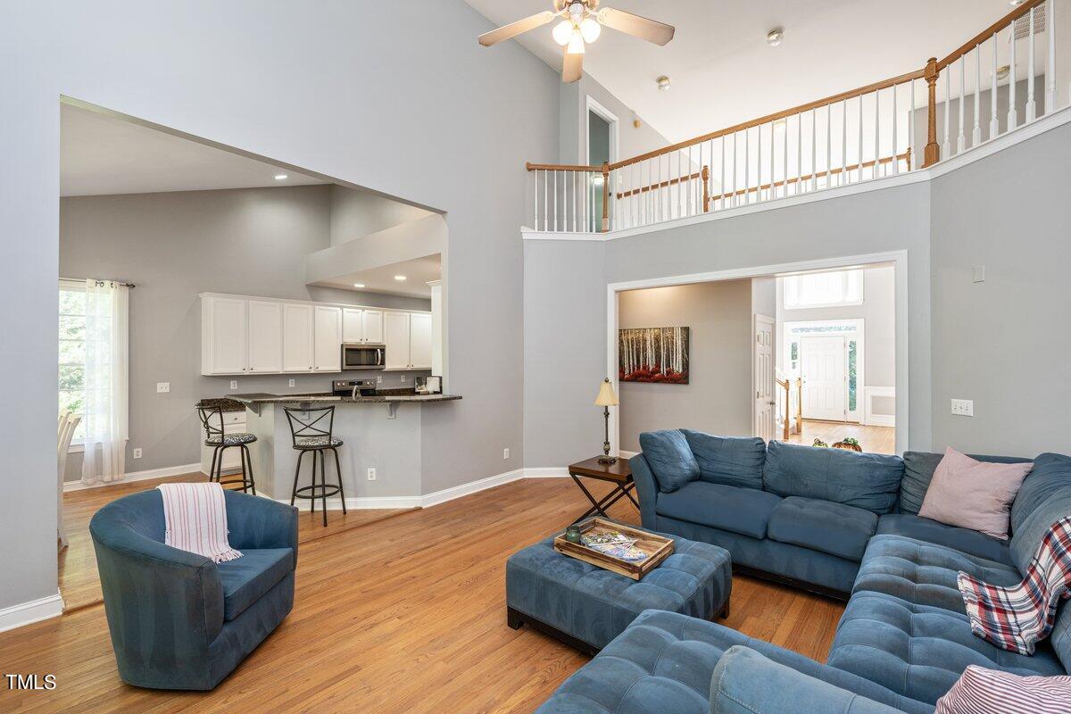 714 Continental Drive Durham, NC 27712 - Photo 10 of 34 a living room with furniture and a view of kitchen