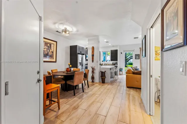 a view of a livingroom with furniture and a flat screen tv