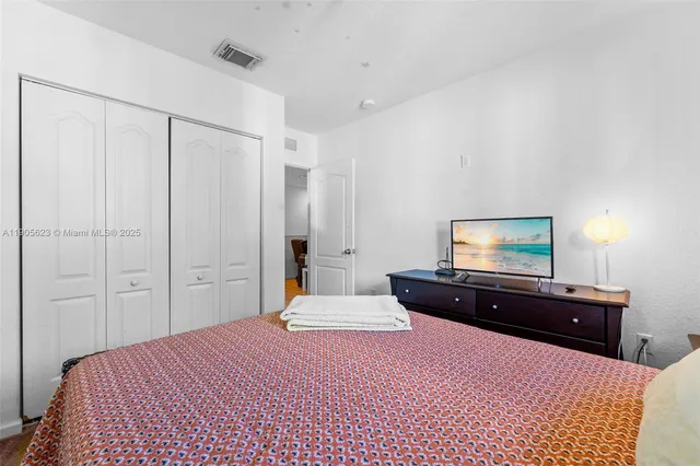 a bathroom with a toilet a sink and a mirror