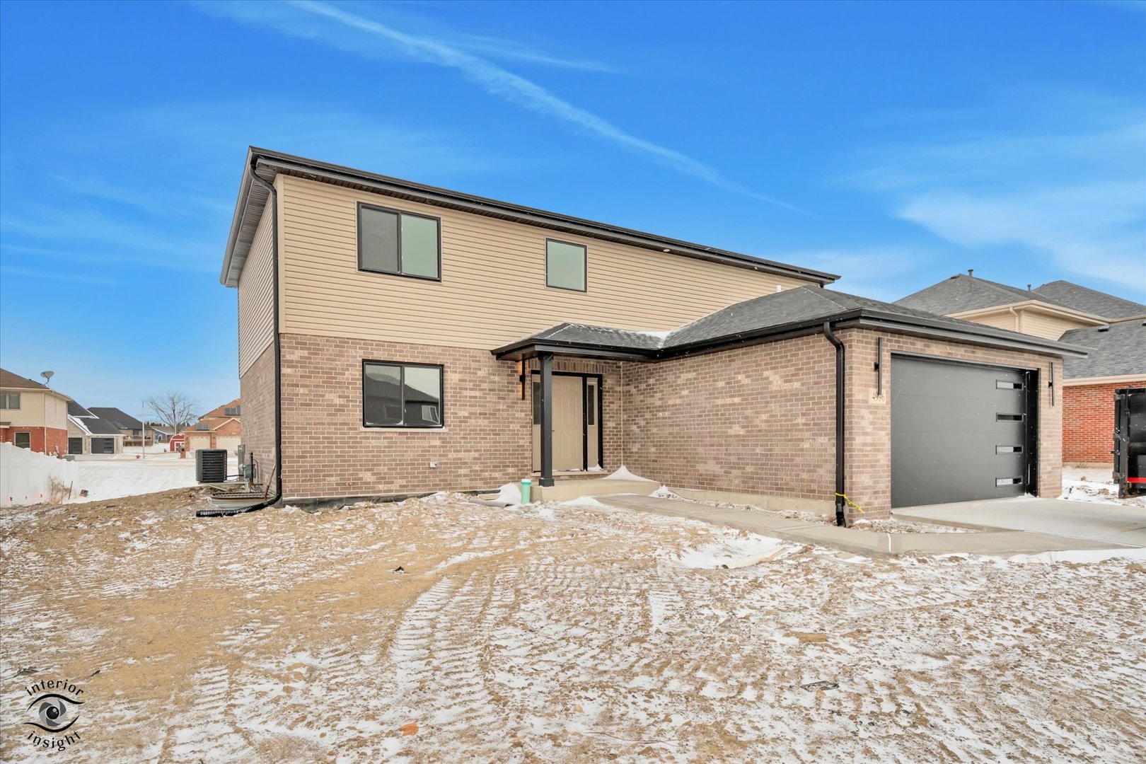 26048 Countyfair Drive Monee, IL 60449 - Photo 2 of 28 a view of a house with a snow in the background