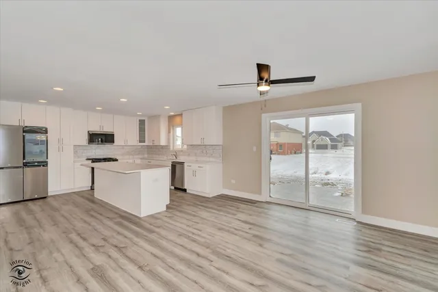 a view of kitchen with wooden floor