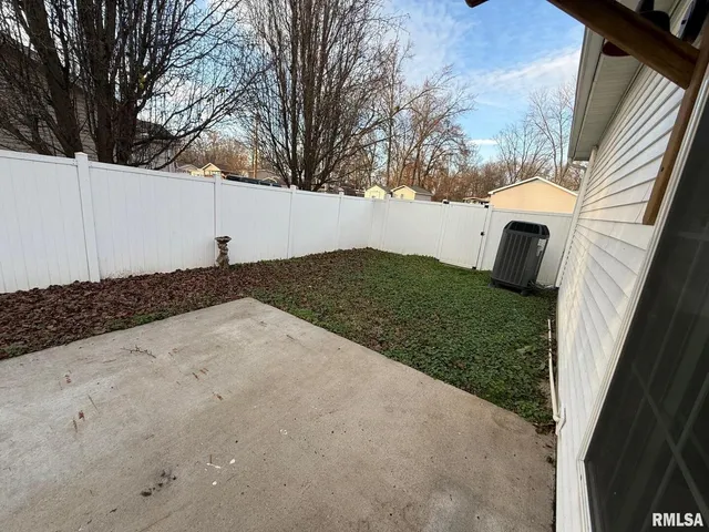 a view of a backyard of the house
