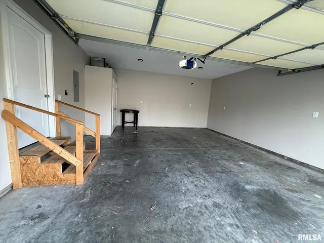 a view of a hallway with stairs