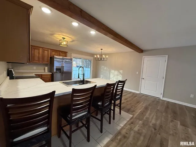 a kitchen with a table and chairs in it