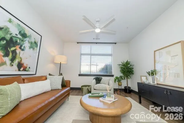 a living room with furniture and a large window