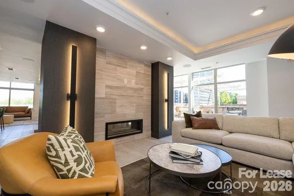 a living room with furniture and a fireplace