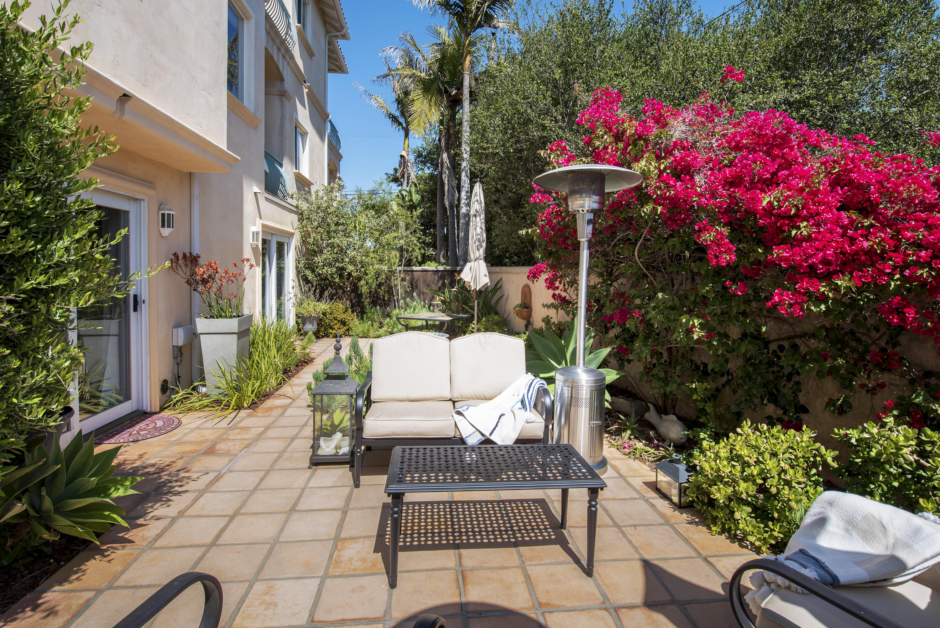 222 Meigs Road, Unit 16 Santa Barbara, CA 93109 - Photo 19 of 26 a view of a patio with furniture and flowers