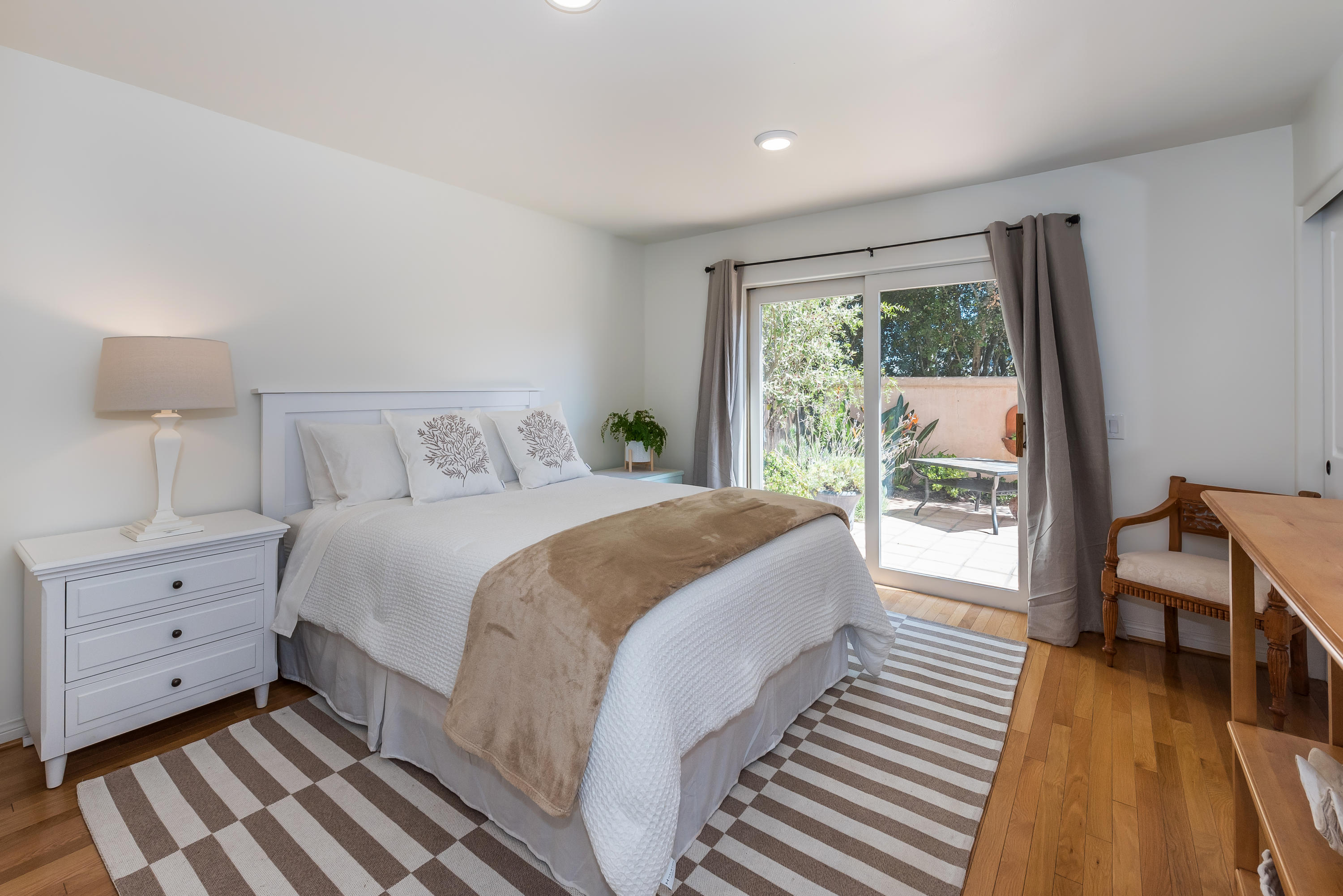 222 Meigs Road, Unit 16 Santa Barbara, CA 93109 - Photo 20 of 26 a bedroom with a bed and a large window