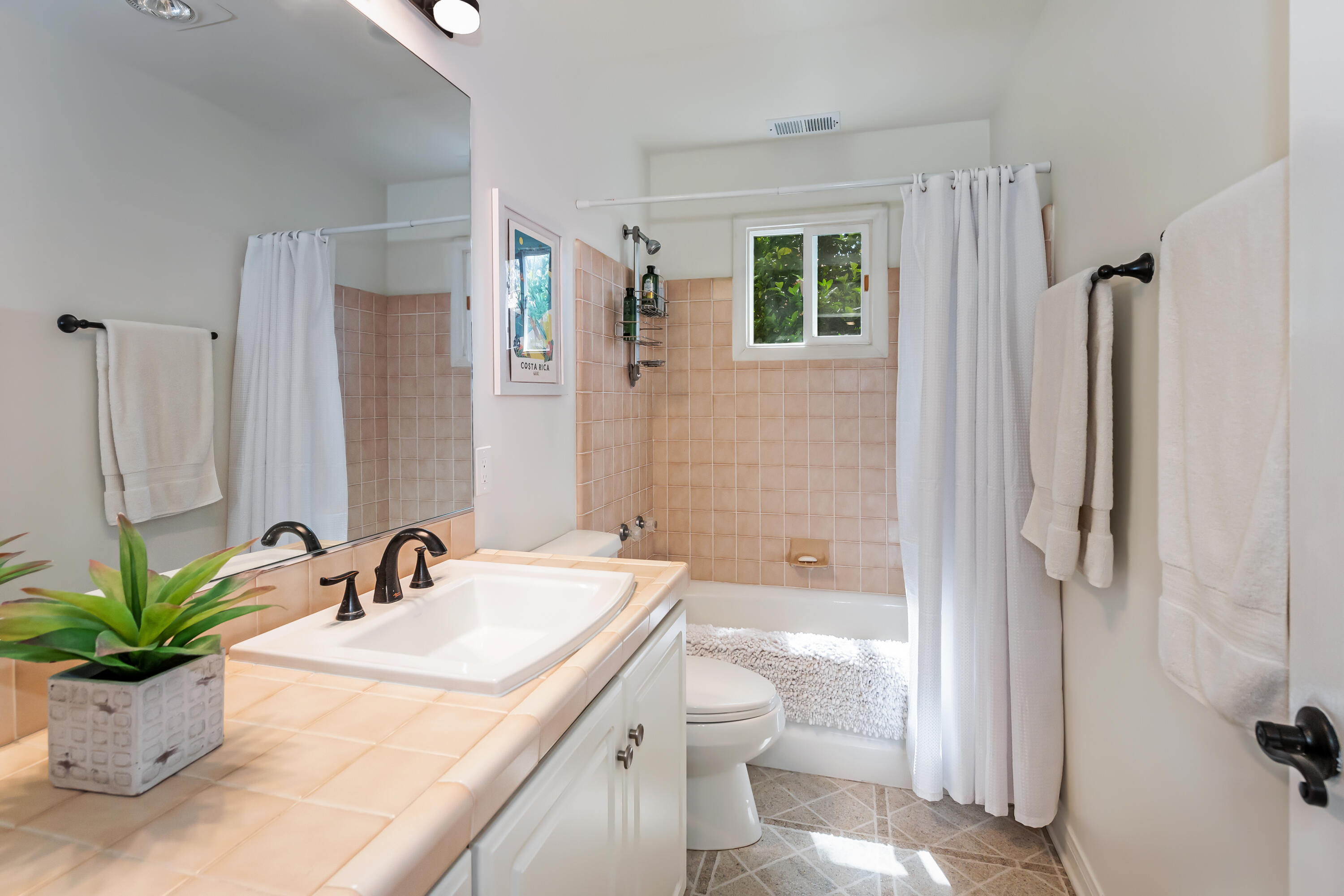 222 Meigs Road, Unit 16 Santa Barbara, CA 93109 - Photo 22 of 26 a bathroom with a sink a toilet and shower