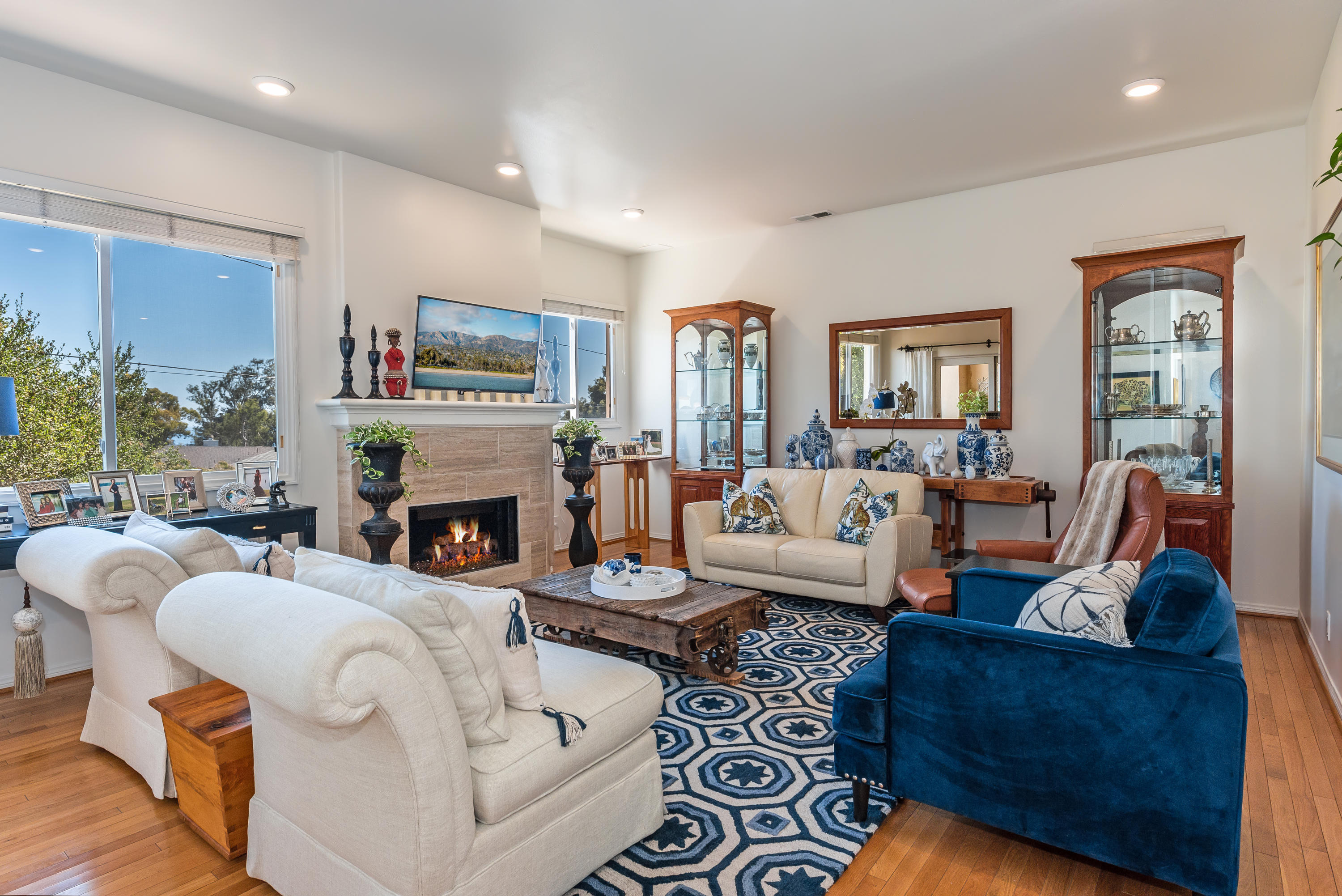 222 Meigs Road, Unit 16 Santa Barbara, CA 93109 - Photo 5 of 26 a living room with furniture fireplace and a large window