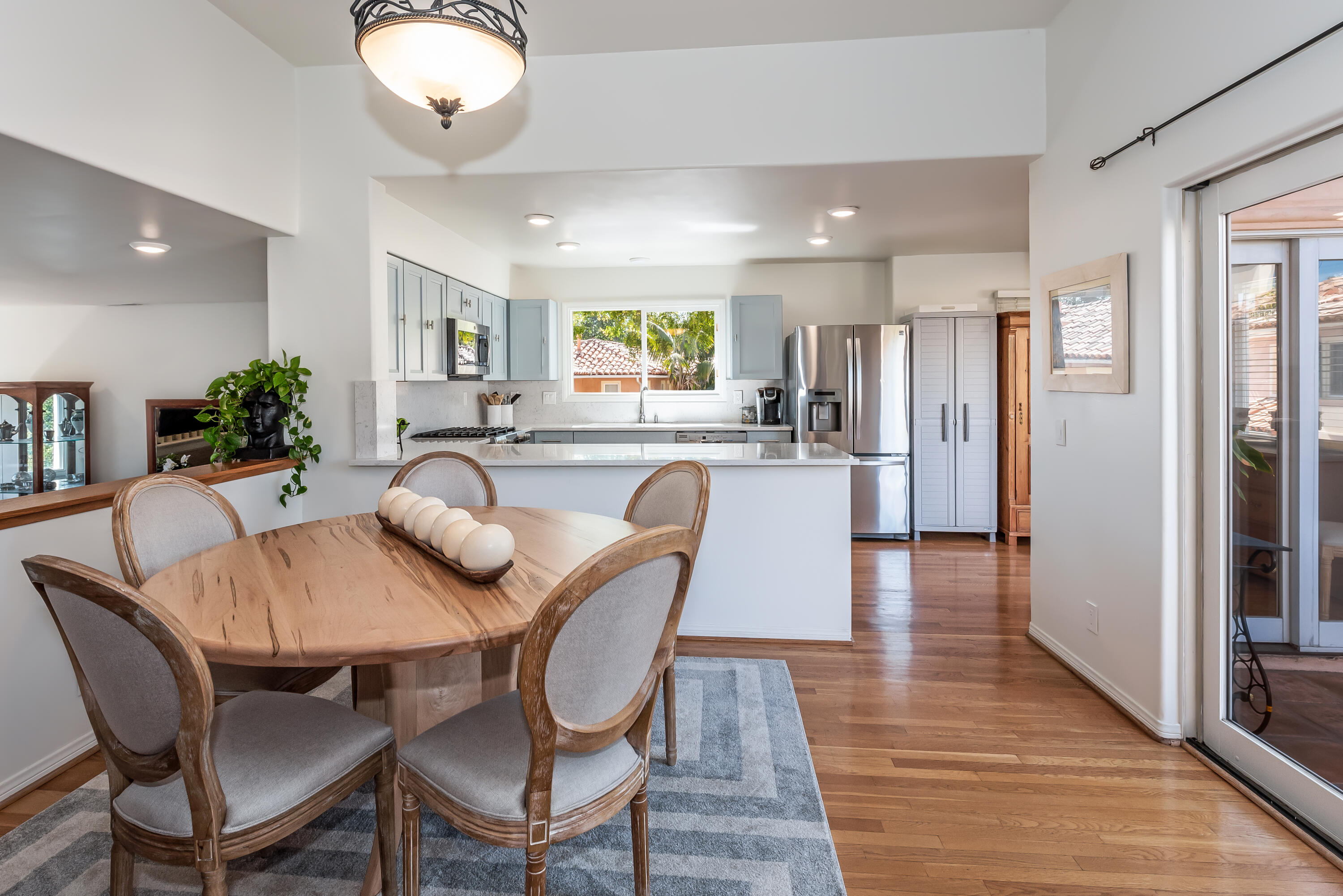 222 Meigs Road, Unit 16 Santa Barbara, CA 93109 - Photo 8 of 26 a view of a dining room with furniture and wooden floor