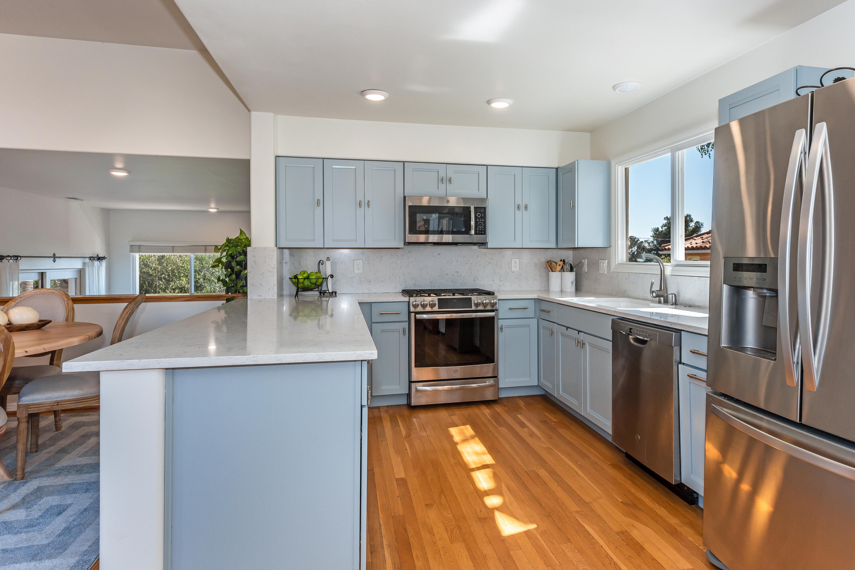 222 Meigs Road, Unit 16 Santa Barbara, CA 93109 - Photo 9 of 26 a kitchen with stainless steel appliances a stove a sink and a refrigerator