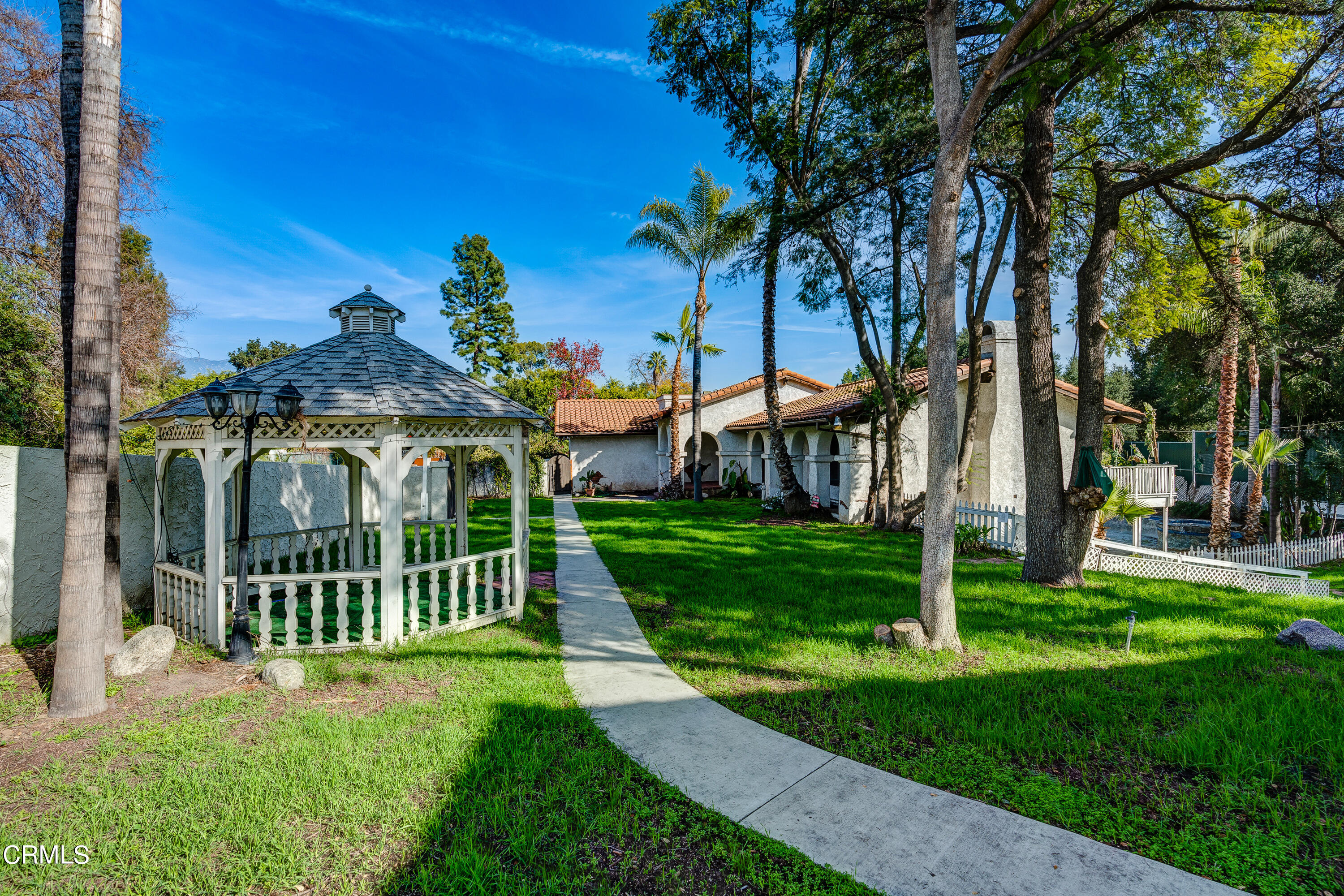 853 Chapea Road Pasadena, CA 91107 - Photo 22 of 32 a view of a house with a small yard and a large tree