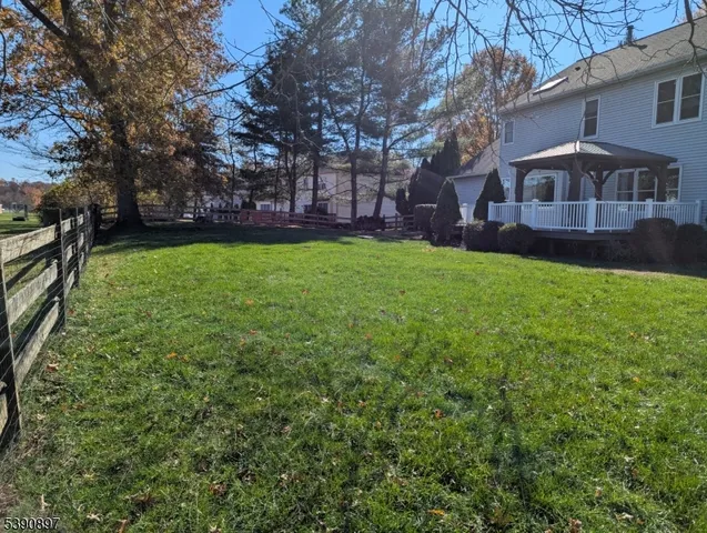 a view of a house with a backyard
