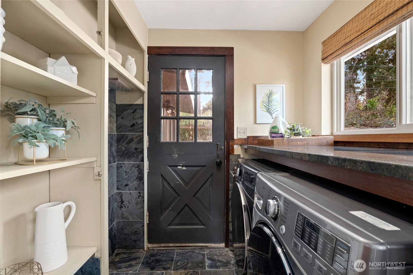 808 Alameda Avenue Fircrest, WA 98466 - Photo 13 of 39 a bathroom with a sink a mirror and next to a window