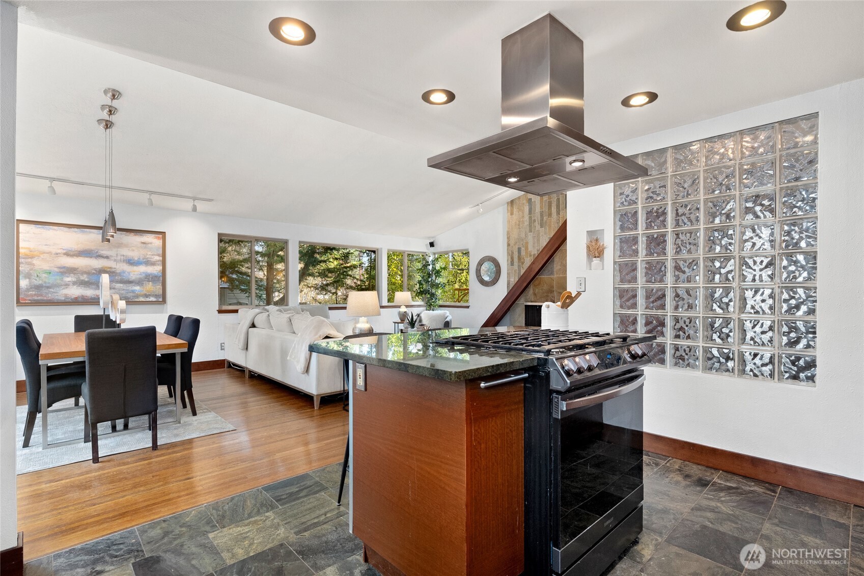 808 Alameda Avenue Fircrest, WA 98466 - Photo 14 of 39 a kitchen with stainless steel appliances granite countertop a stove a sink and a dining table