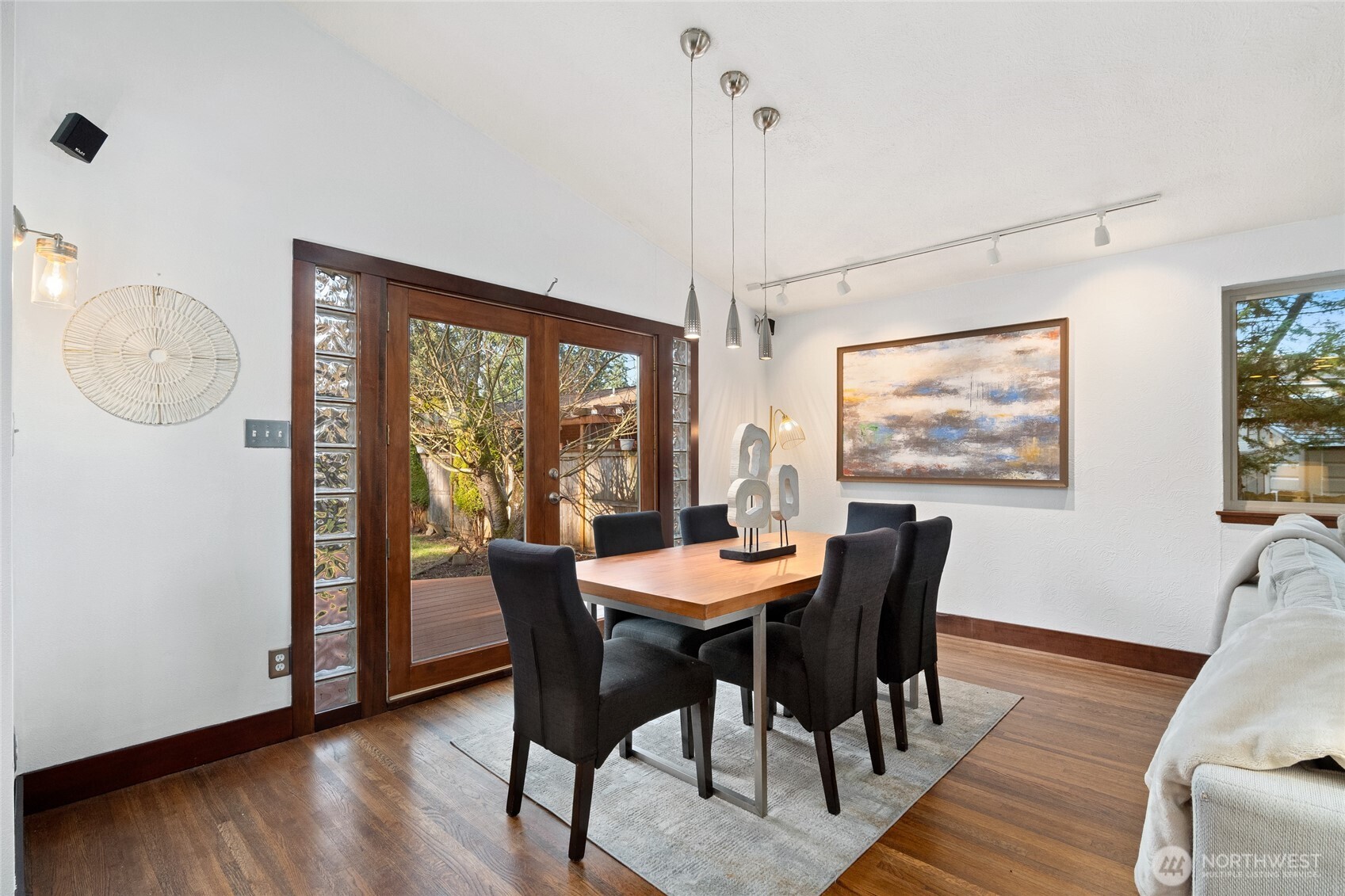 808 Alameda Avenue Fircrest, WA 98466 - Photo 15 of 39 a dining room with furniture a chandelier and wooden floor