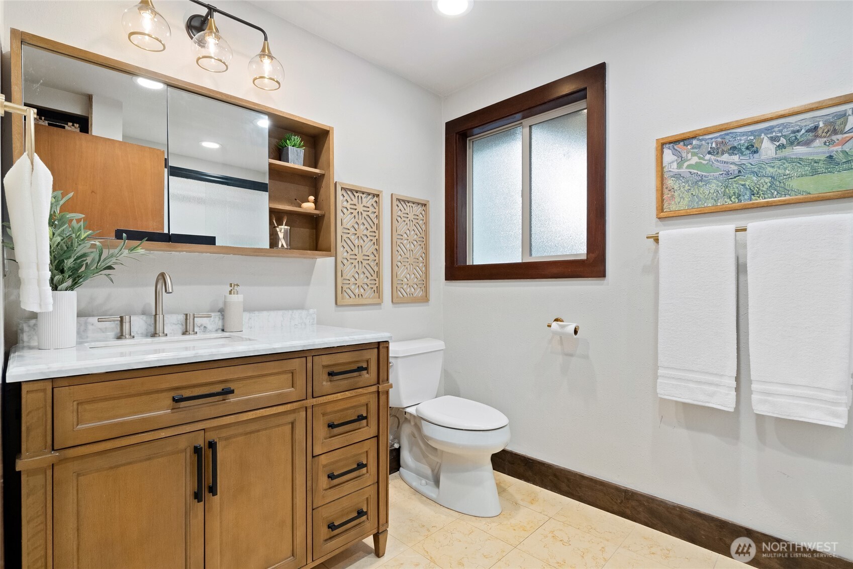 808 Alameda Avenue Fircrest, WA 98466 - Photo 18 of 39 a bathroom with a sink a toilet and mirror