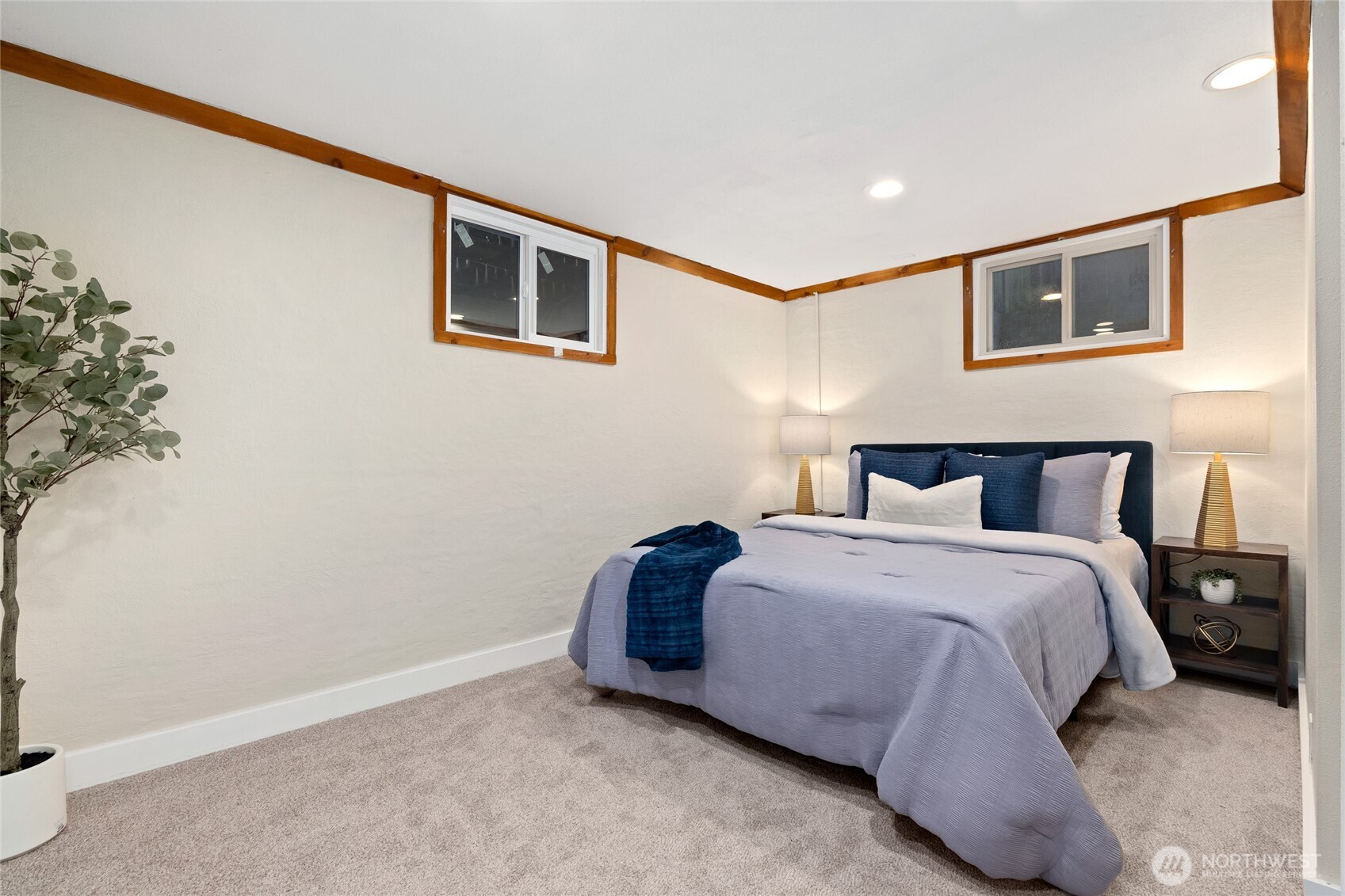 808 Alameda Avenue Fircrest, WA 98466 - Photo 25 of 39 a spacious bedroom with a bed and a painting on the wall