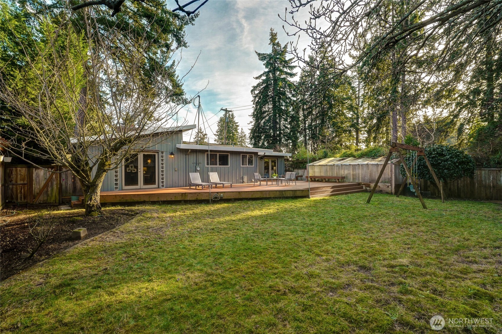 808 Alameda Avenue Fircrest, WA 98466 - Photo 31 of 39 a view of house with outdoor space and swimming pool