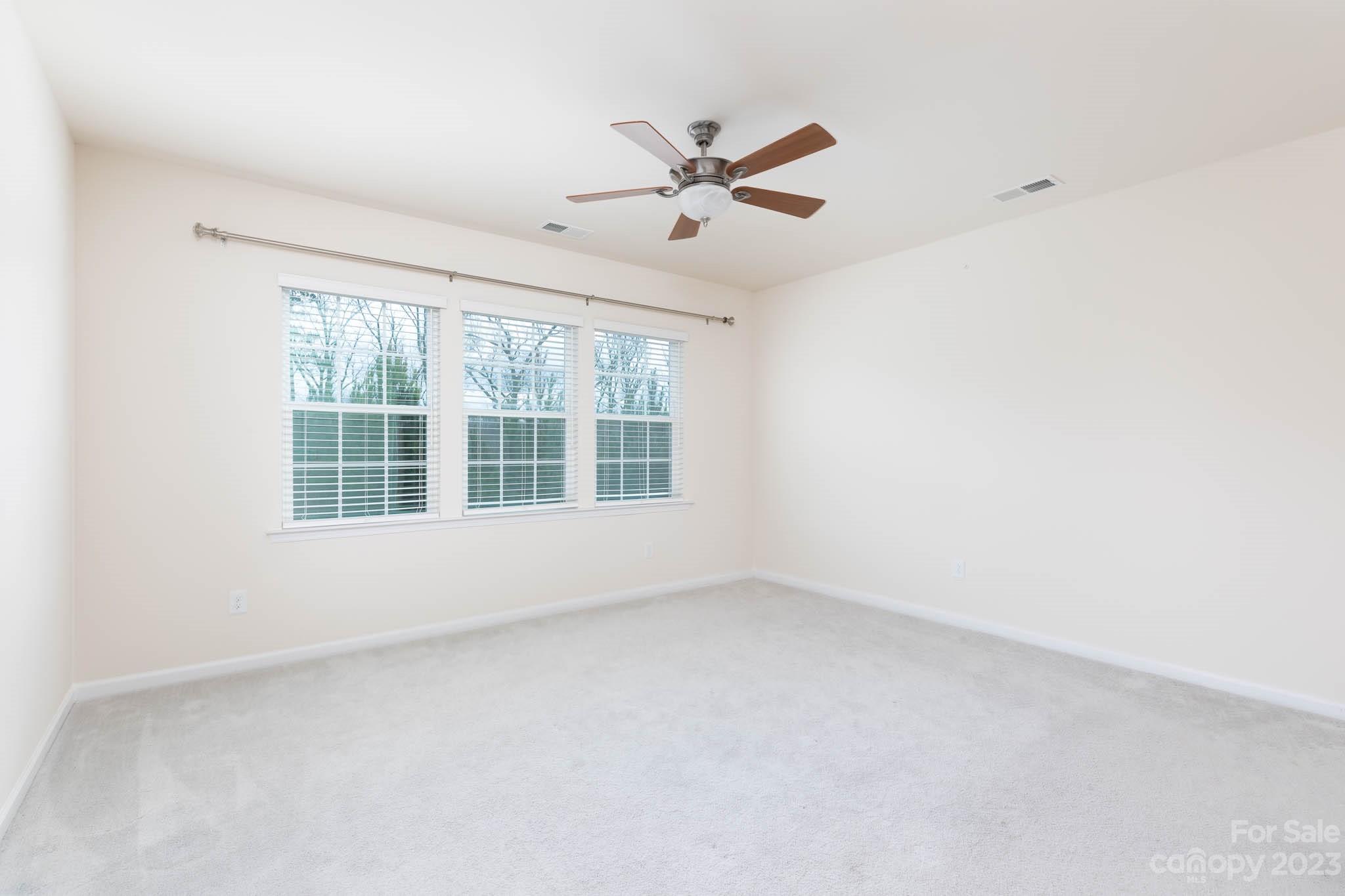1609 Tranquility Boulevard Lancaster, SC 29720 - Photo 12 of 35 an empty room with a window