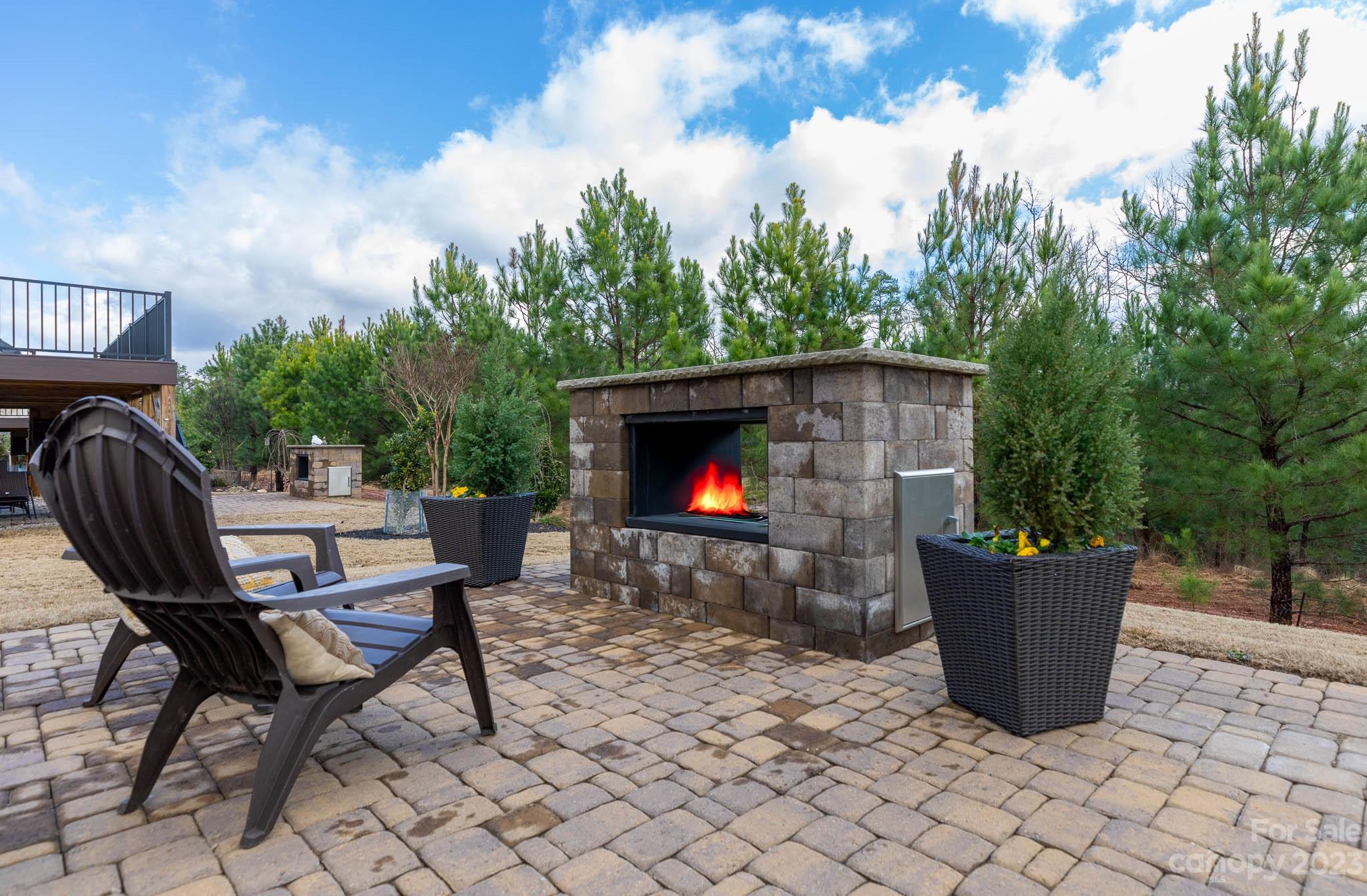 1609 Tranquility Boulevard Lancaster, SC 29720 - Photo 25 of 35 a view of a chairs and table in backyard