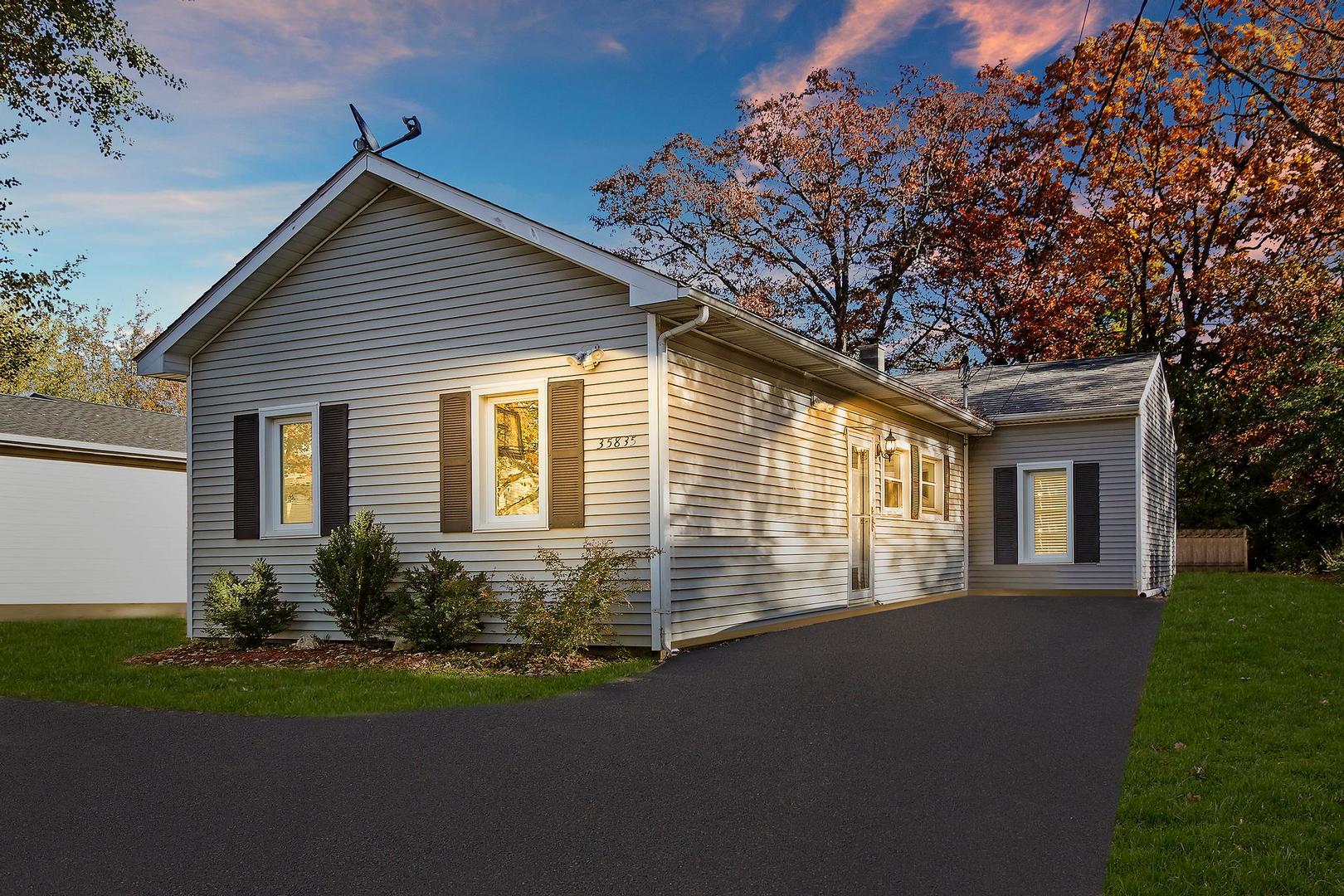 35835 North Benjamin Avenue Ingleside, IL 60041 - Photo 1 of 17 a front view of house with yard and green space