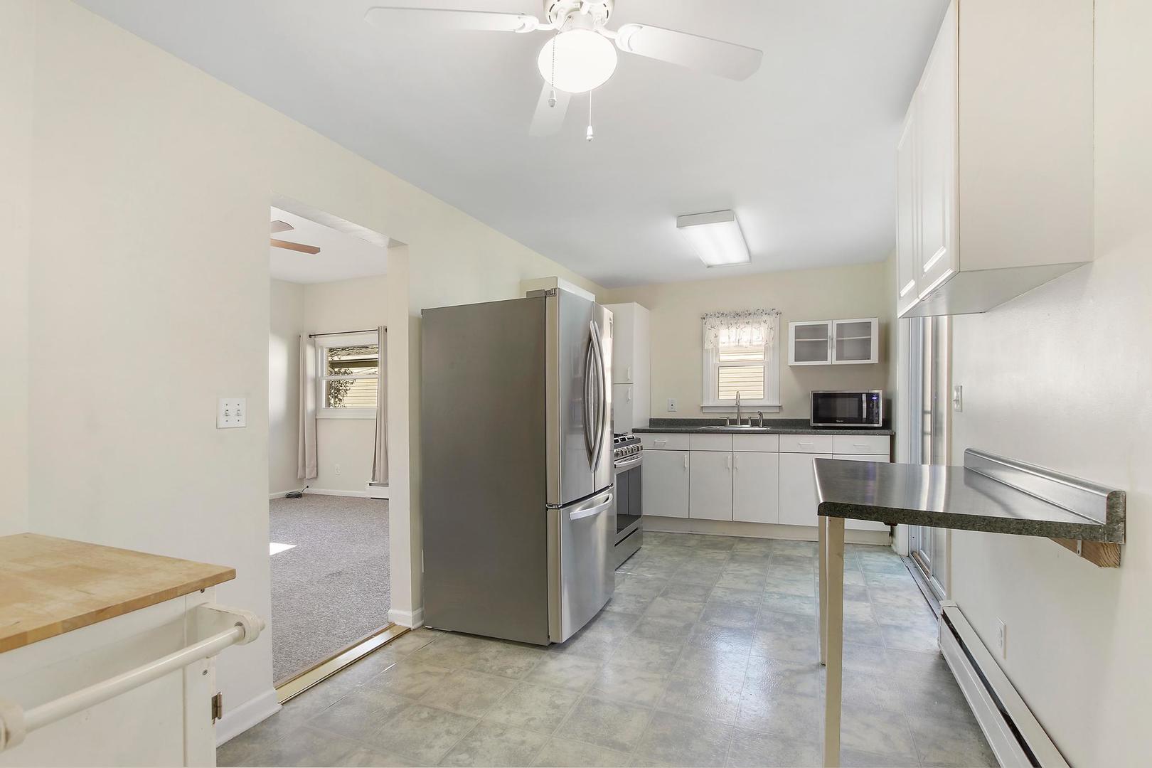35835 North Benjamin Avenue Ingleside, IL 60041 - Photo 12 of 17 a kitchen with stainless steel appliances a refrigerator and a stove top oven