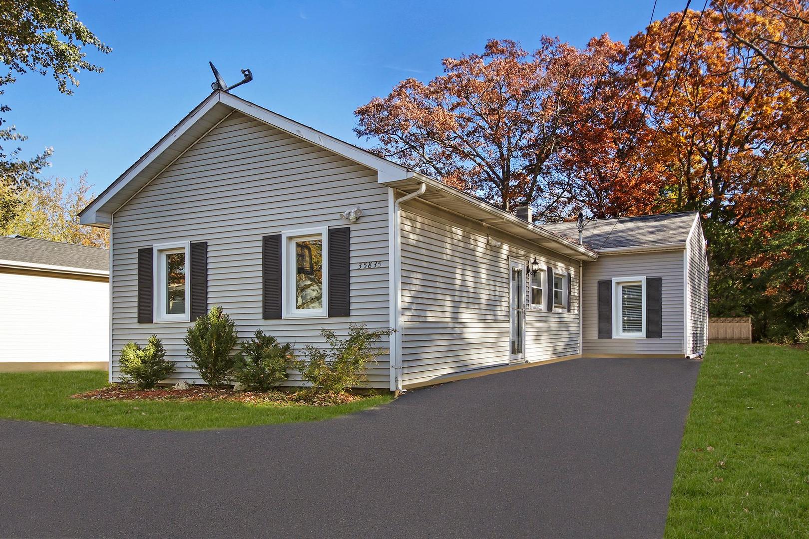 35835 North Benjamin Avenue Ingleside, IL 60041 - Photo 2 of 17 a front view of house with yard and green space