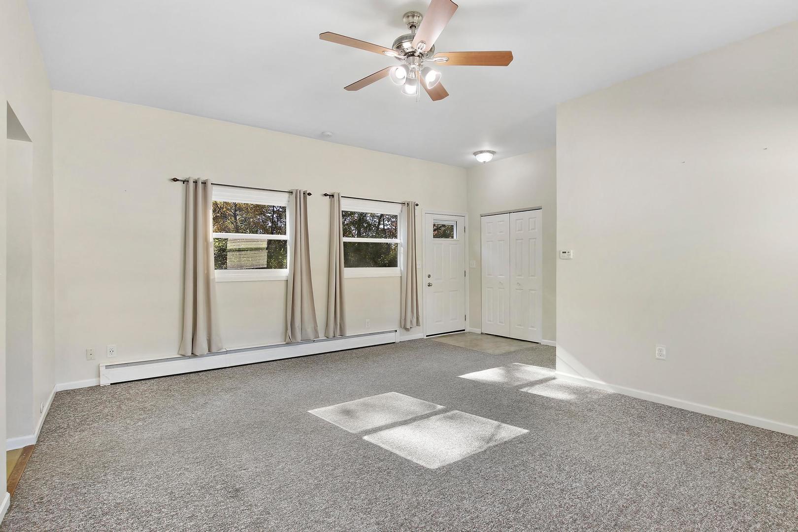 35835 North Benjamin Avenue Ingleside, IL 60041 - Photo 4 of 17 an empty room with windows and fan