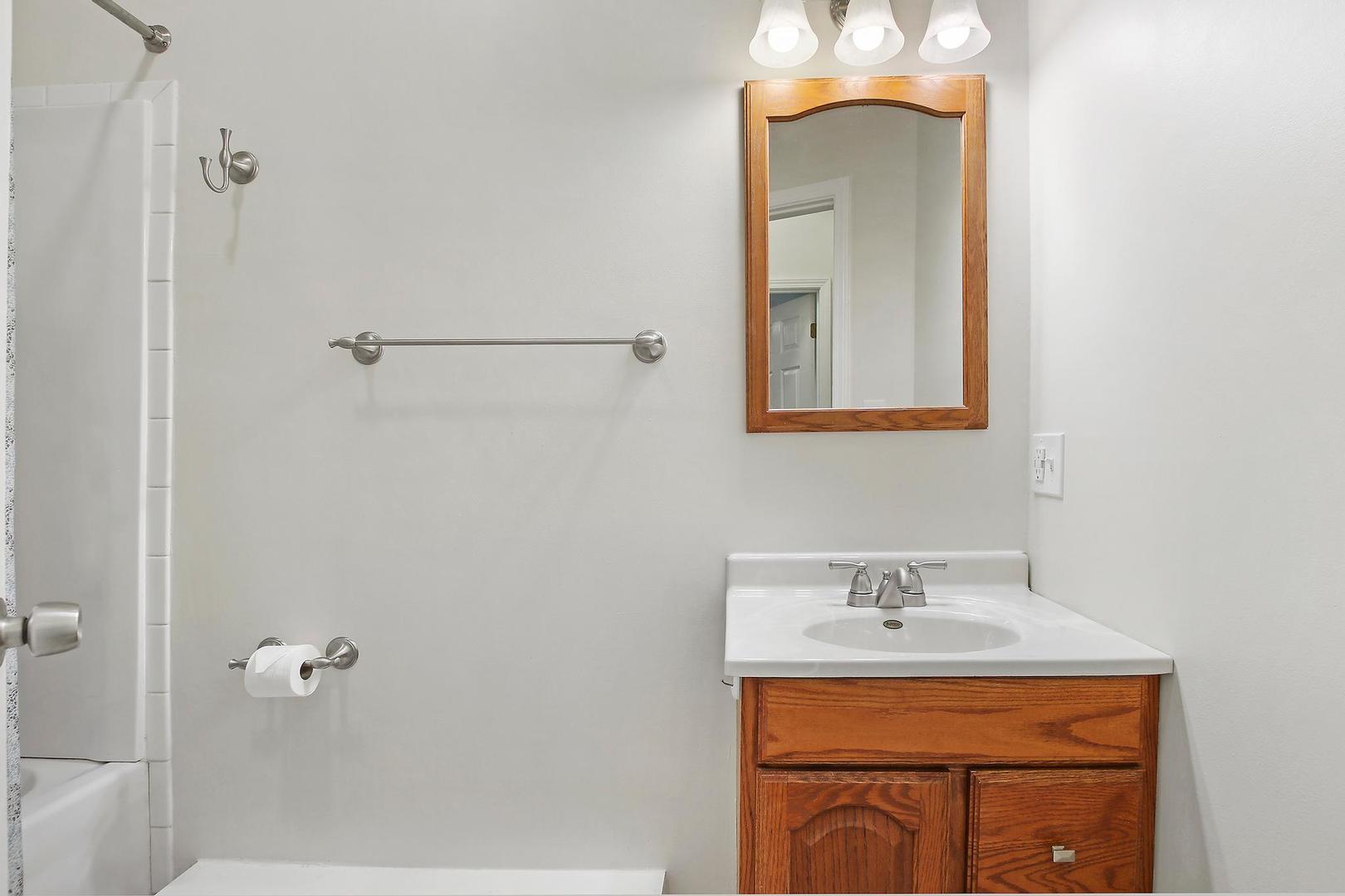 35835 North Benjamin Avenue Ingleside, IL 60041 - Photo 9 of 17 a bathroom with a sink a vanity and a mirror