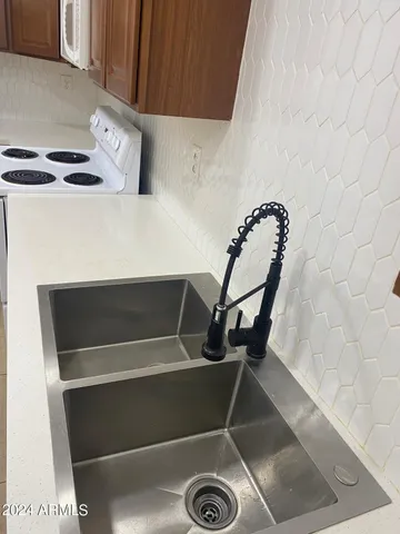 a view of storage and utility room with washer and dryer