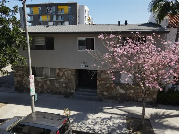a view of a street with a tree