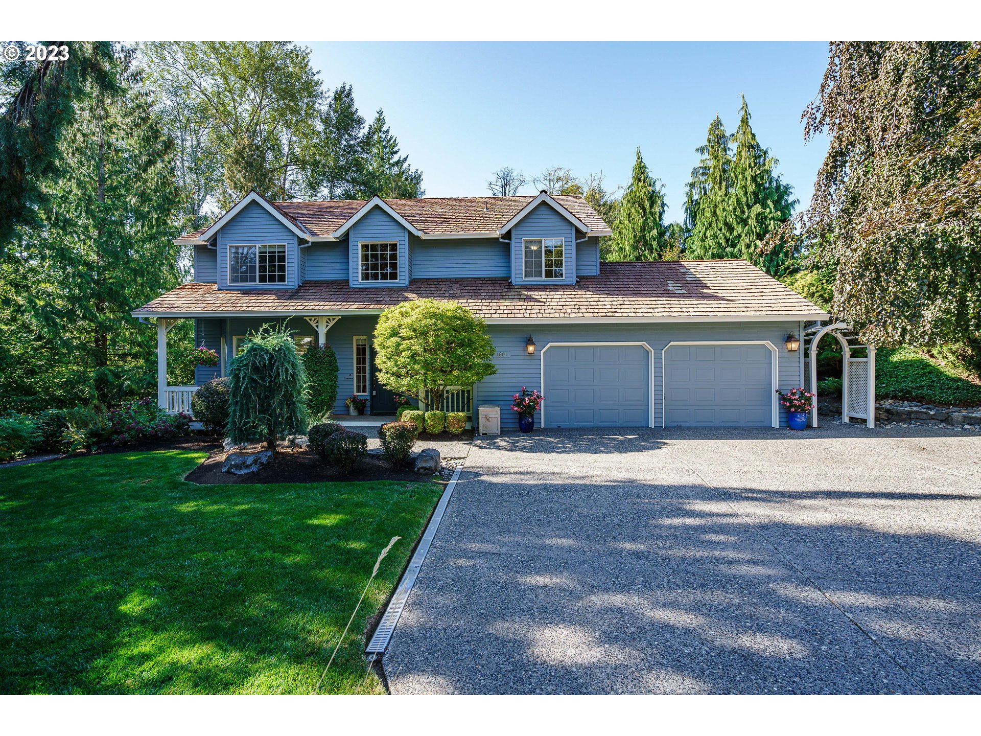 a front view of a house with garden