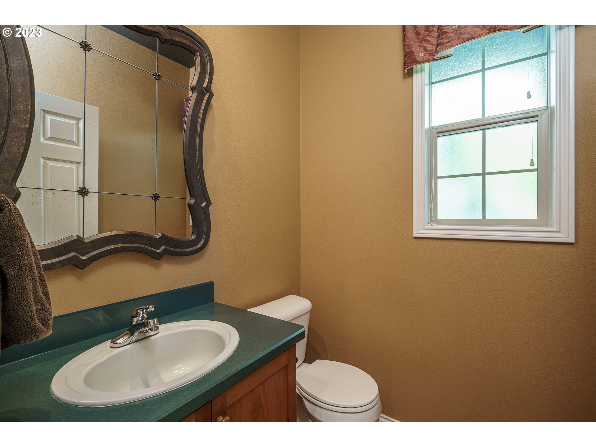 1601 Southeast Elliott Avenue Gresham, OR 97080 - Photo 11 of 48 a bathroom with a sink and a mirror