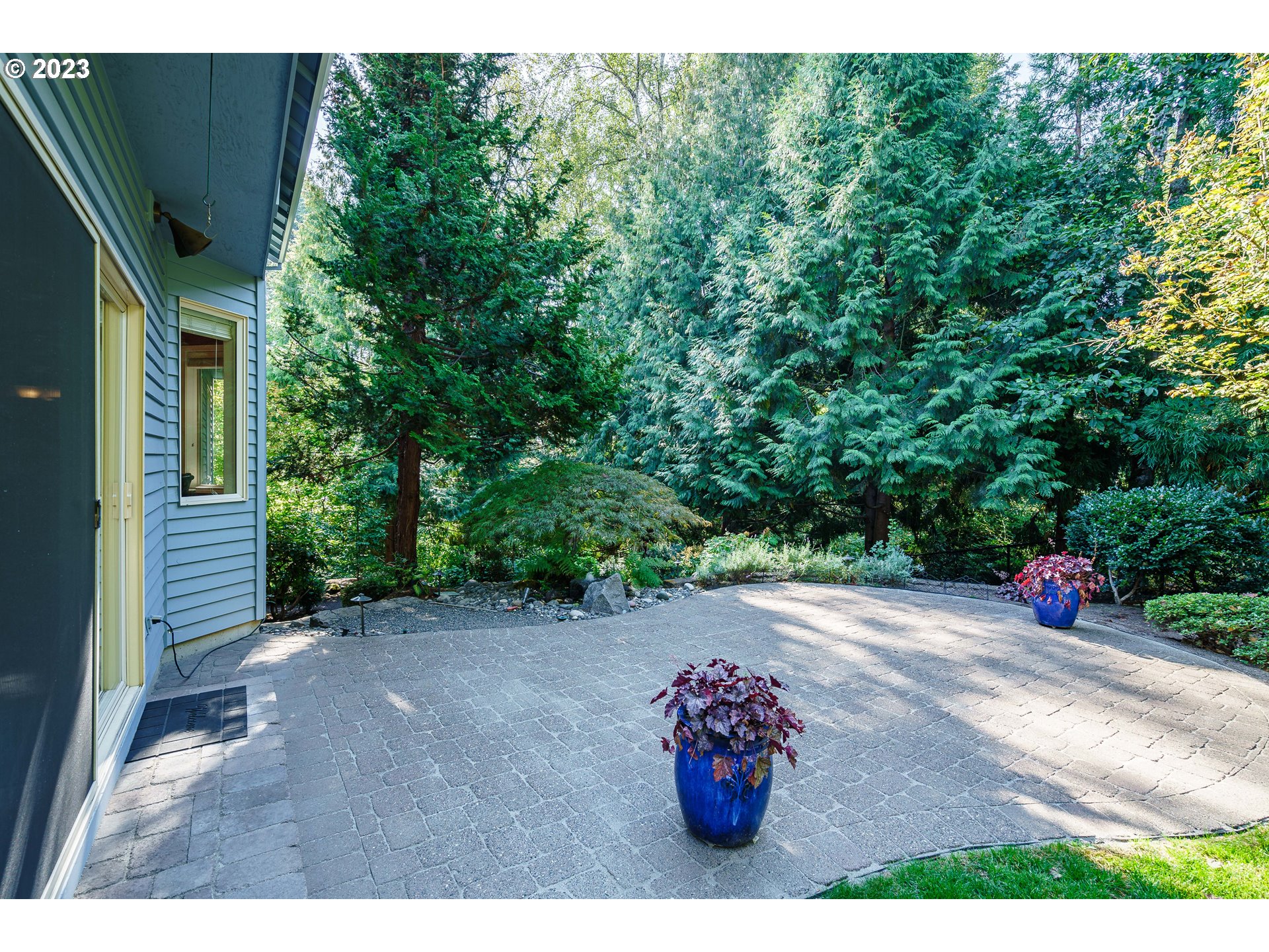 1601 Southeast Elliott Avenue Gresham, OR 97080 - Photo 30 of 48 a view of a backyard with a table and a chair