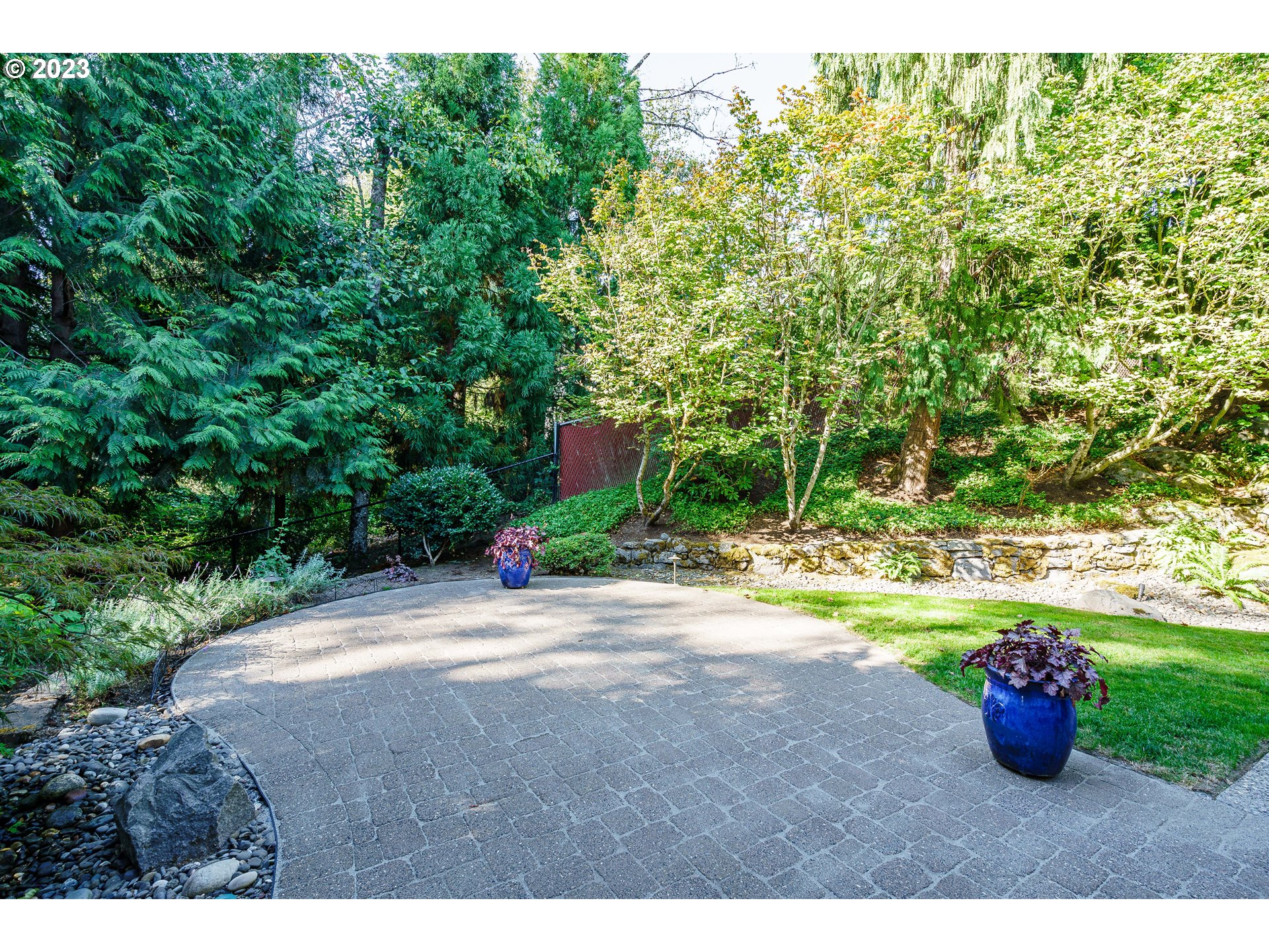 1601 Southeast Elliott Avenue Gresham, OR 97080 - Photo 31 of 48 a view of a backyard with table and chairs and potted plants