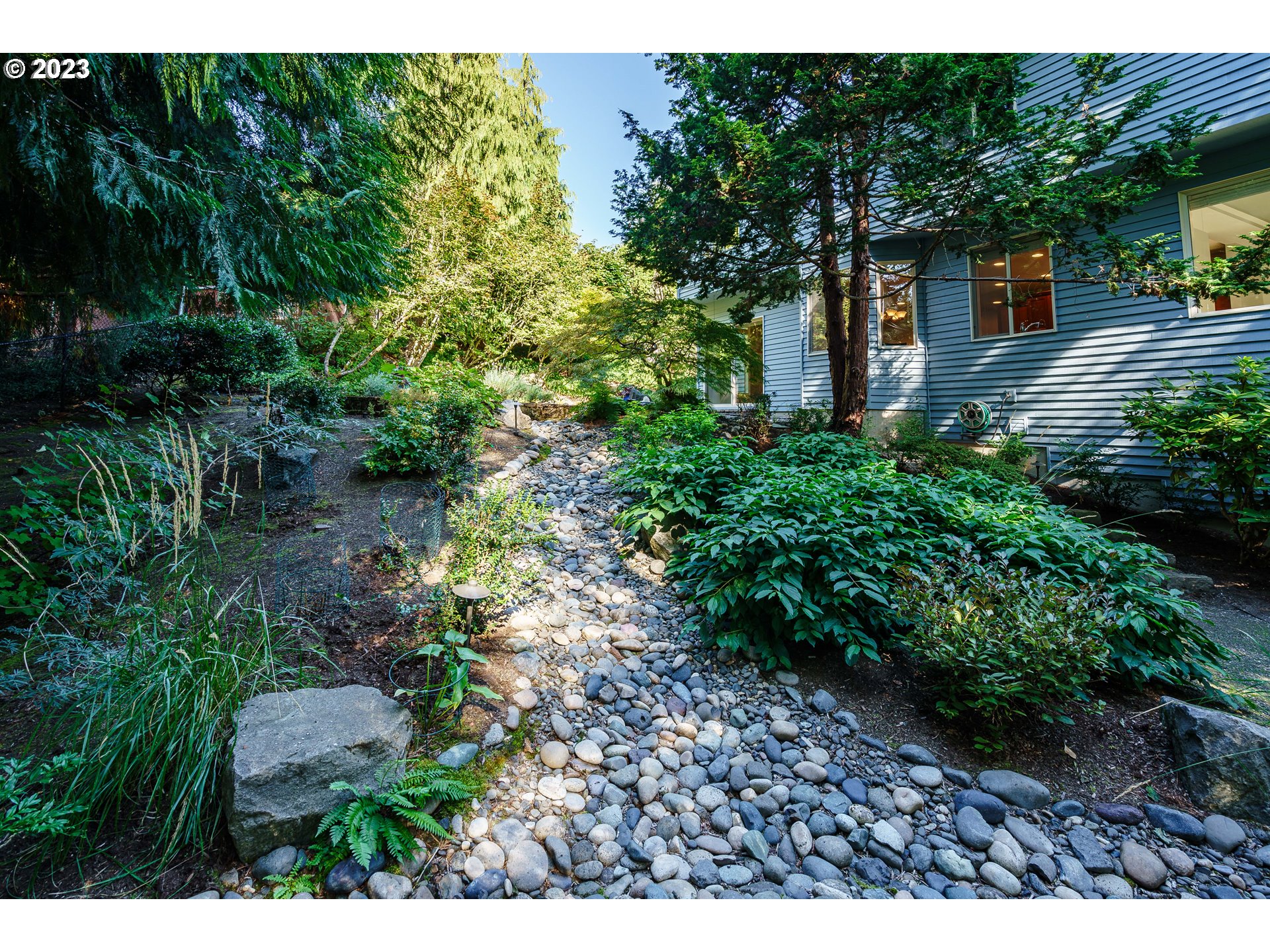 1601 Southeast Elliott Avenue Gresham, OR 97080 - Photo 34 of 48 a view of backyard with plants and outdoor seating