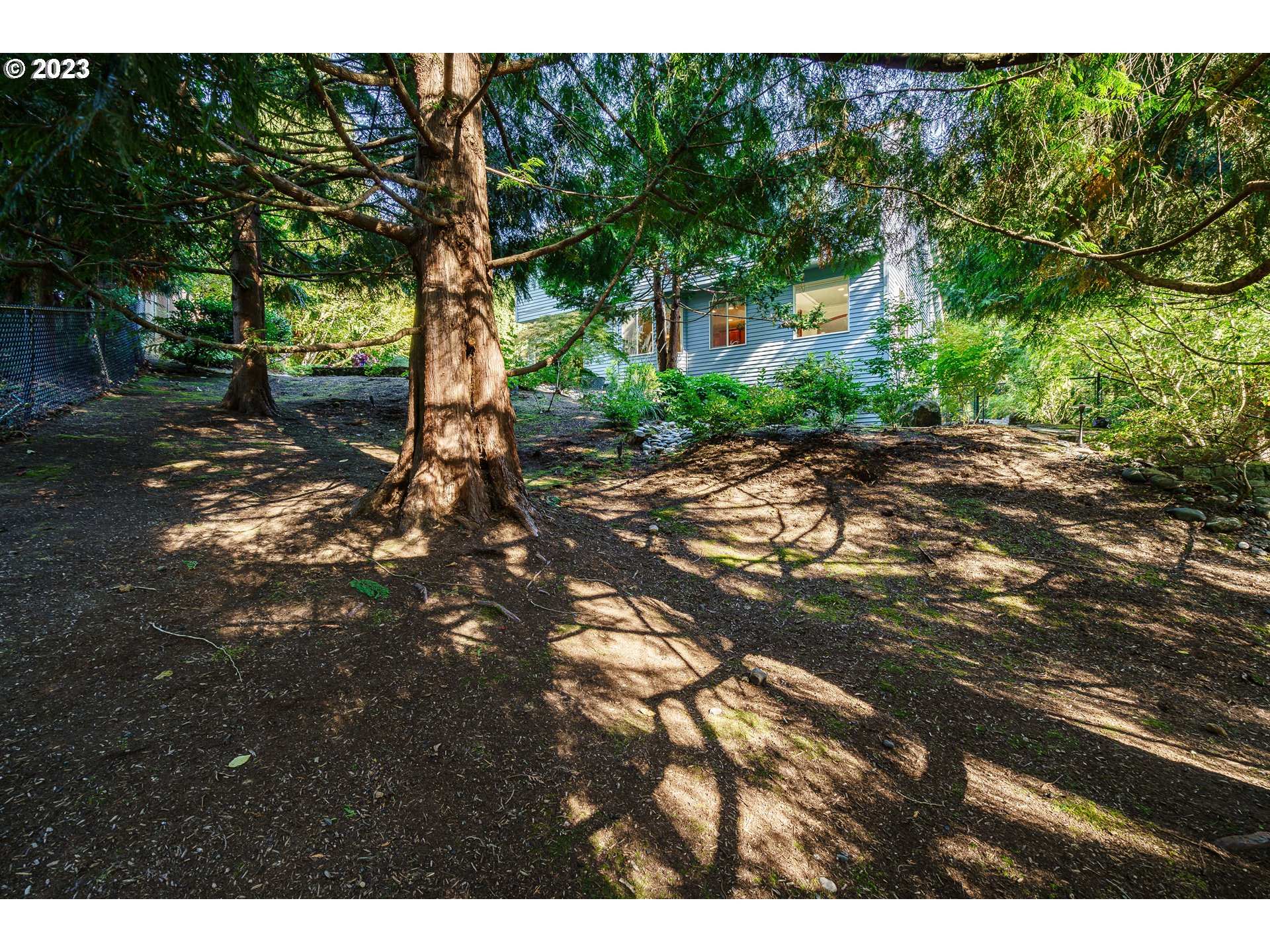 1601 Southeast Elliott Avenue Gresham, OR 97080 - Photo 35 of 48 a backyard of a house with lots of green space