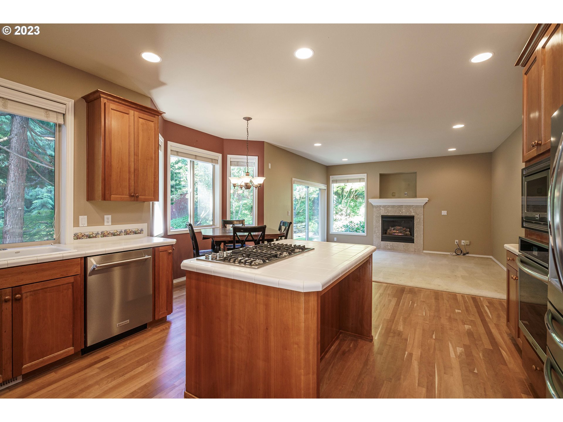 1601 Southeast Elliott Avenue Gresham, OR 97080 - Photo 6 of 48 a kitchen with stainless steel appliances granite countertop a sink stove and wooden cabinets