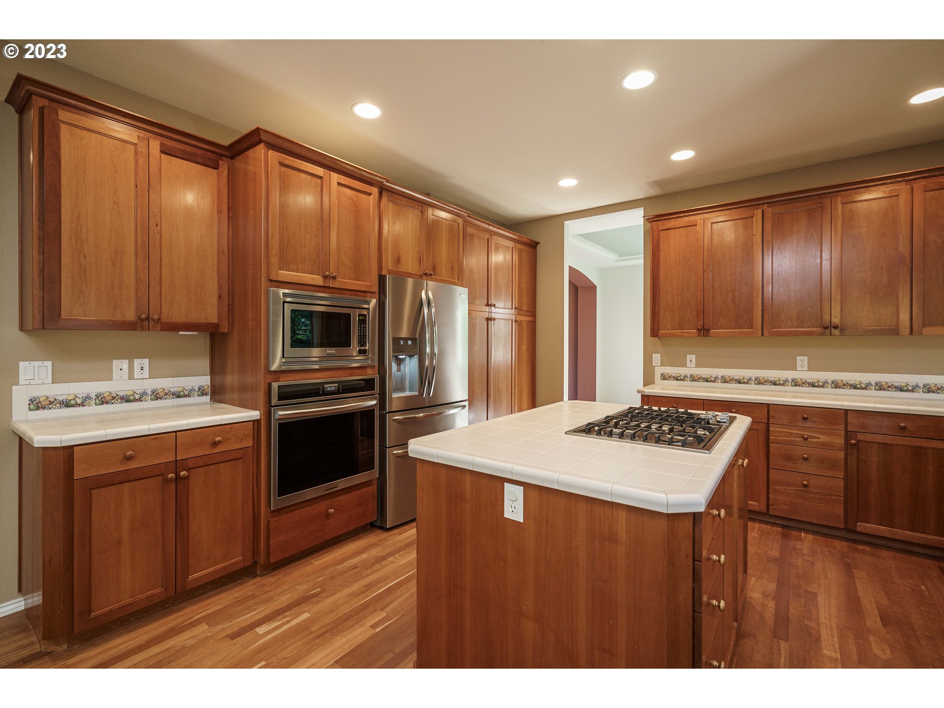 1601 Southeast Elliott Avenue Gresham, OR 97080 - Photo 8 of 48 a kitchen with kitchen island granite countertop stainless steel appliances cabinets a sink and a counter