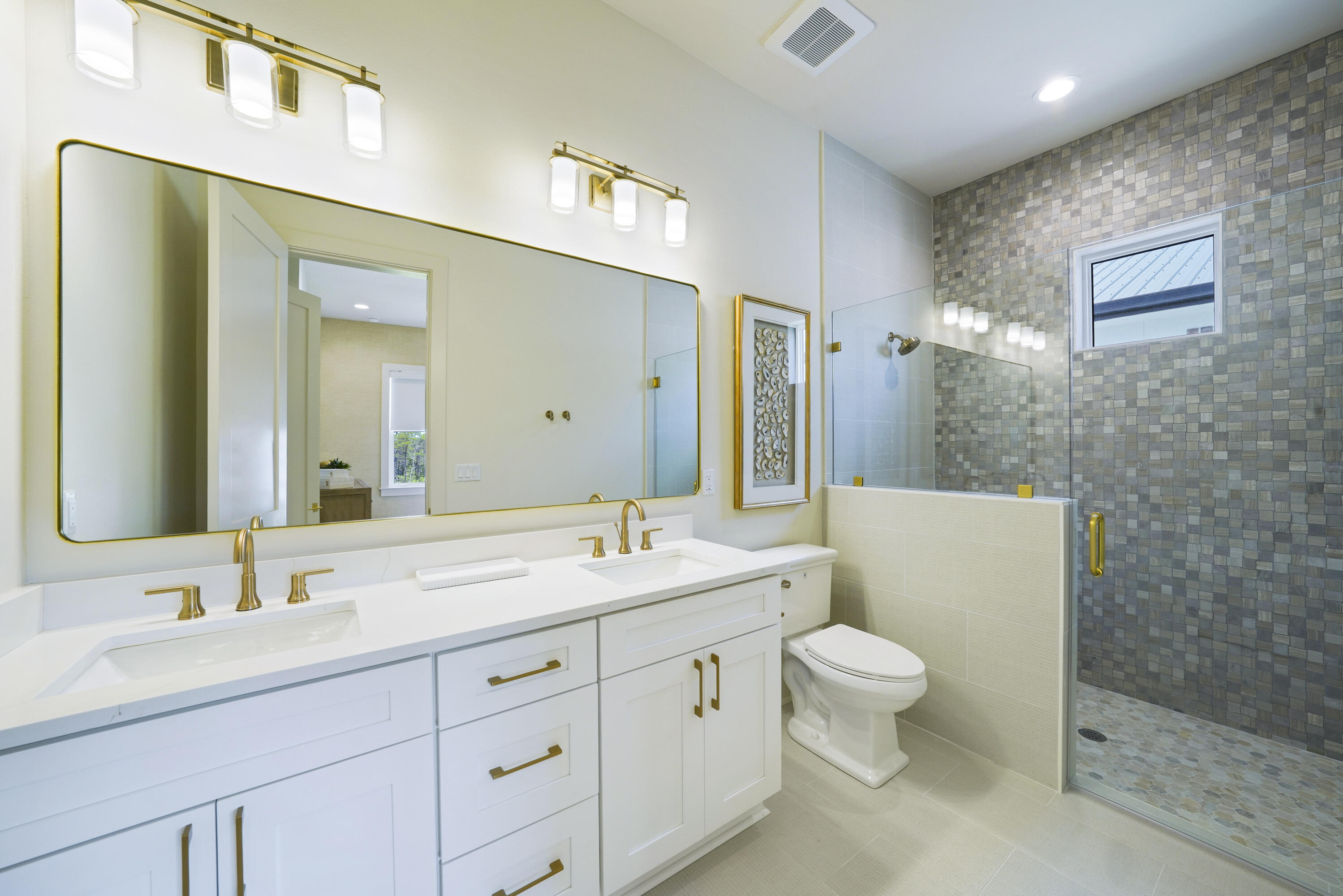 56 Sea Croft Cove Santa Rosa Beach, FL 32459 - Photo 47 of 65 a spacious bathroom with a double vanity sink toilet mirror and shower