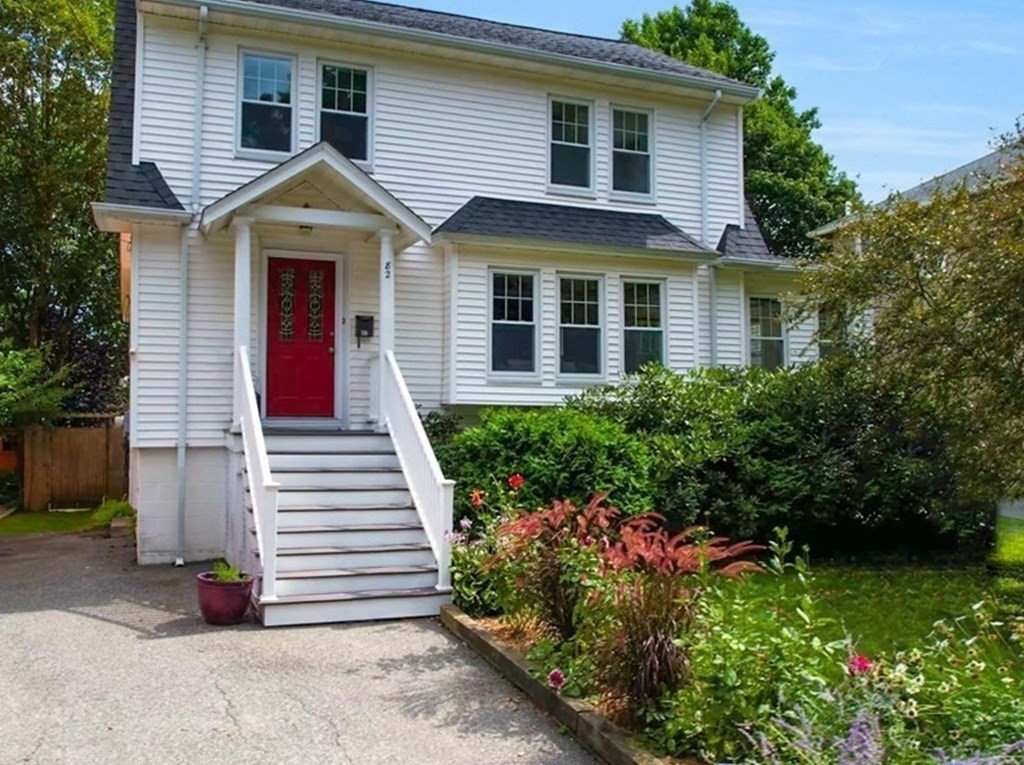 82 Roberts Road Medford, MA 02155 - Photo 1 of 30 a front view of a house with a yard