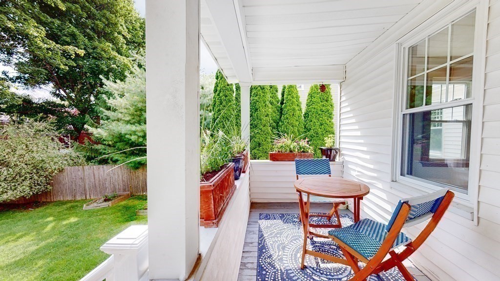 82 Roberts Road Medford, MA 02155 - Photo 20 of 30 a view of a porch with furniture and a yard