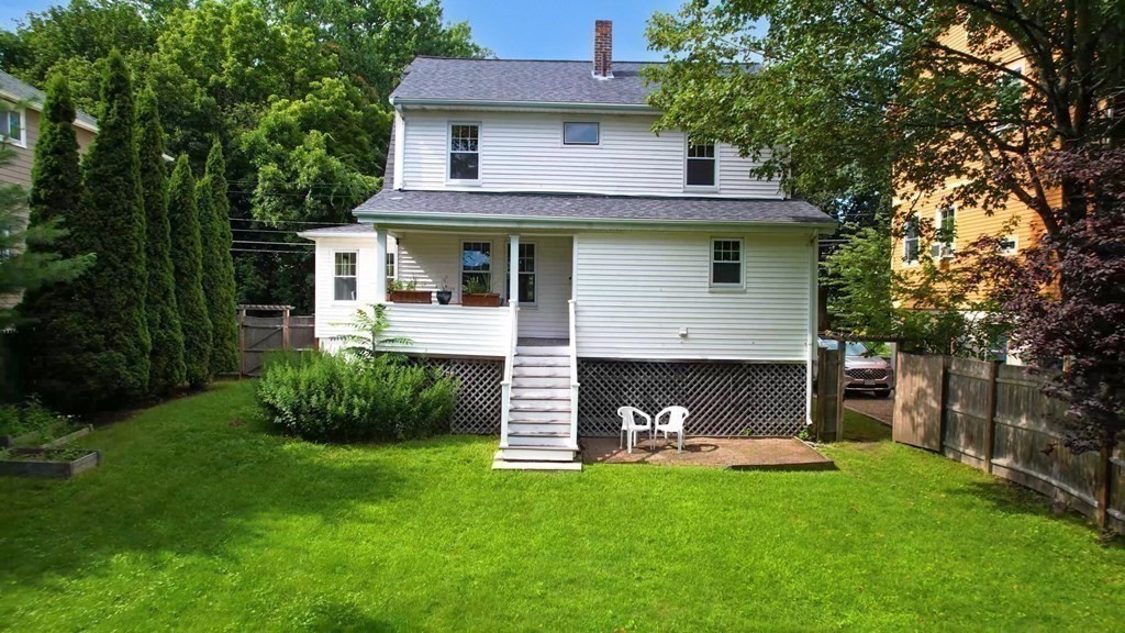 82 Roberts Road Medford, MA 02155 - Photo 24 of 30 a front view of a house with a yard and trees