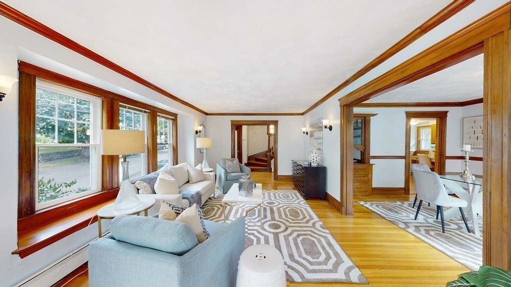 82 Roberts Road Medford, MA 02155 - Photo 3 of 30 a bedroom with furniture and a large window